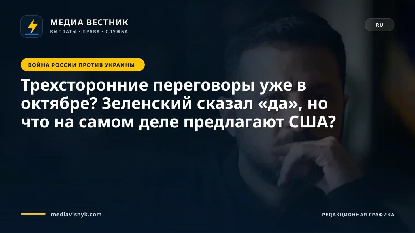 Бородатый мужчина в чёрной рубашке сидит, опираясь рукой на рот, и смотрит в камеру в помещении с тусклым освещением и размытым фоном.